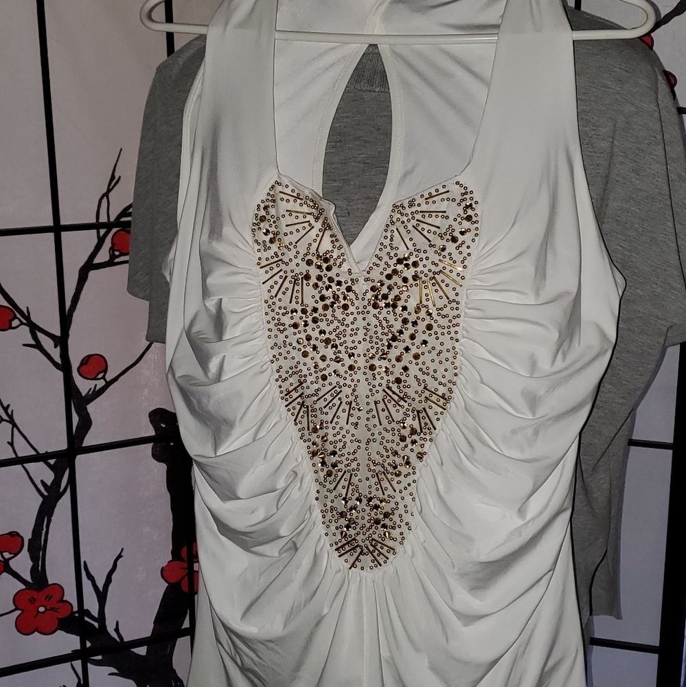 White sleeveless top with gold accents